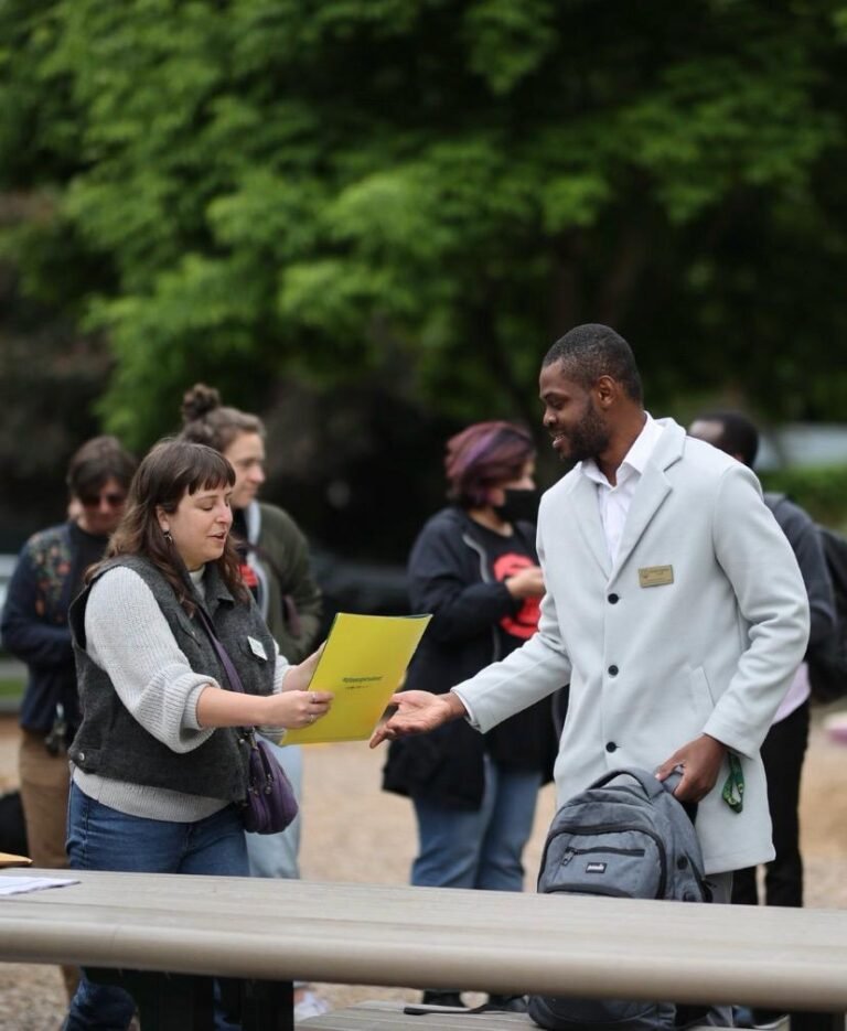 Daniel Appiah Gyekye engaging community members at a Eugene street safety event