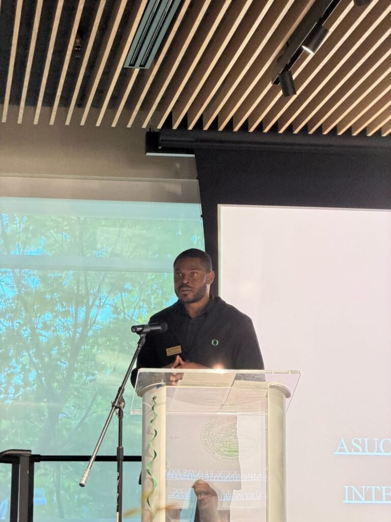 Daniel Appiah Gyekye speaking at a lecture podium
